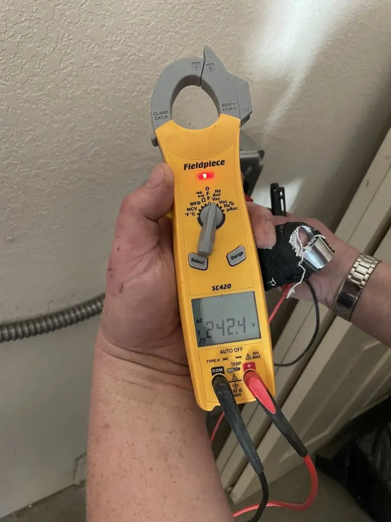 Voltage testing with clamp meter during Aluminum Wiring Replacement in Arcade